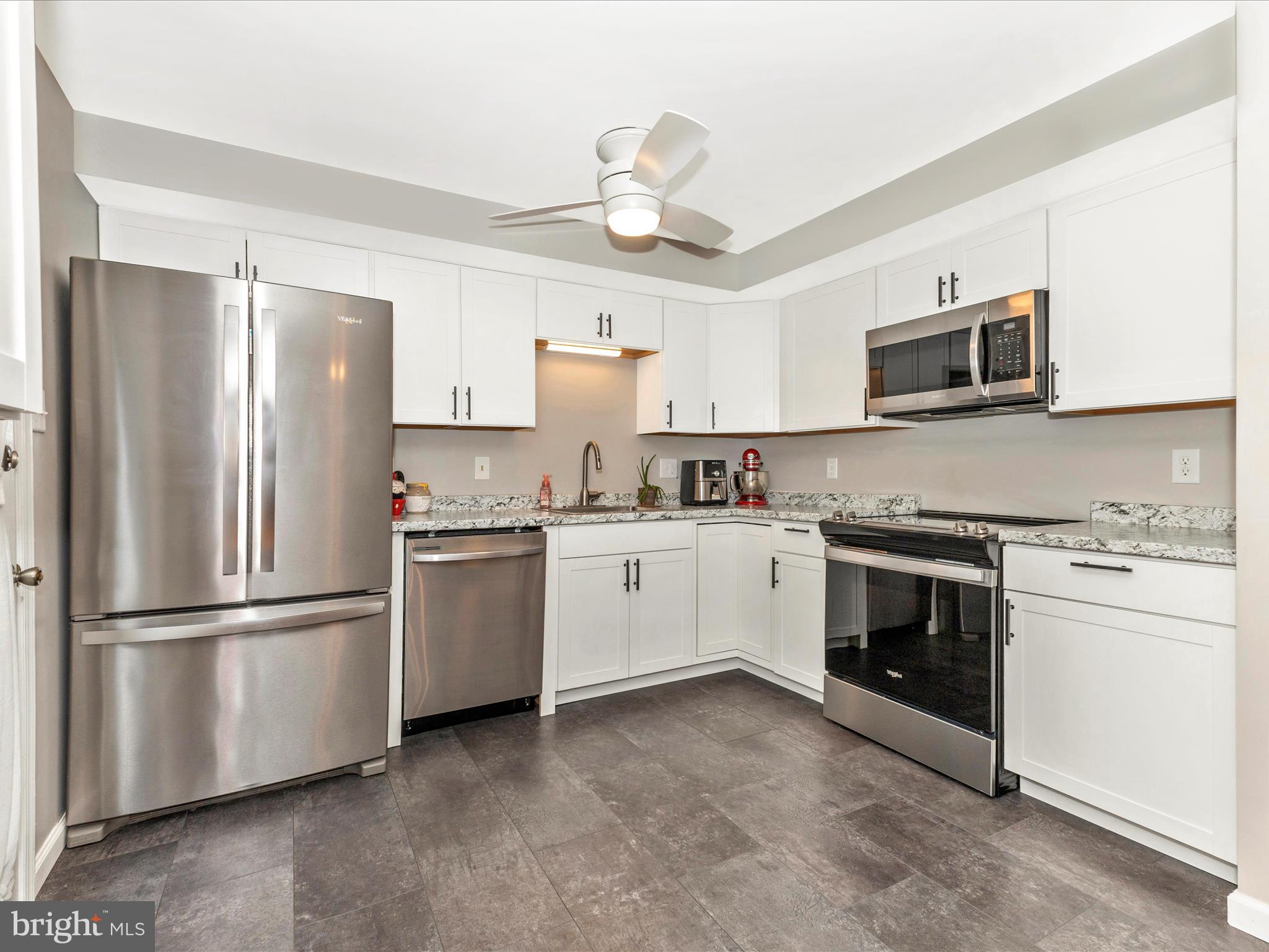 8204 Red Wing Court Frederick, MD 21701 - Photo 8 of 72 a kitchen with stainless steel appliances white cabinets and a refrigerator
