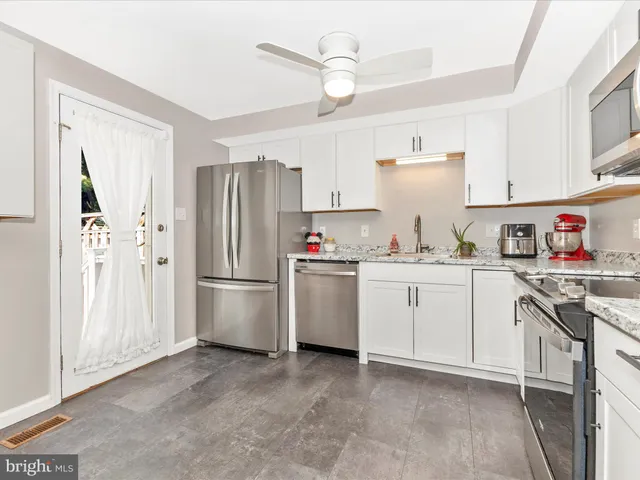 a view of a dining room with furniture and a table
