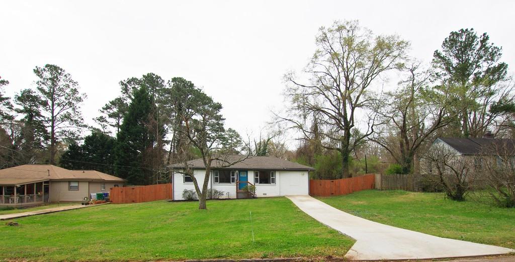 3129 Leeland Road Decatur, GA 30032 - Photo 1 of 1 a front view of house with yard and green space