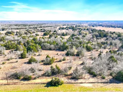 a view of a yard with a lake view