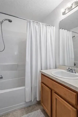 a bathroom with a sink and a shower