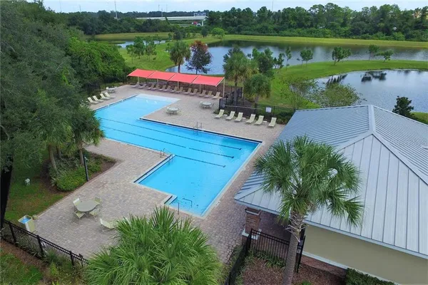 a lake view with a sitting space and a garden