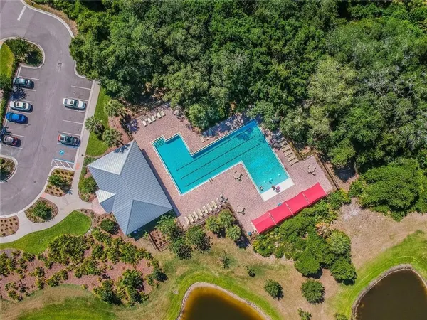 an aerial view of a house with yard