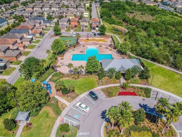 an aerial view of residential houses with outdoor space and street view