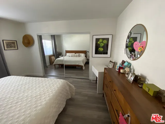 a bedroom with bed and a window