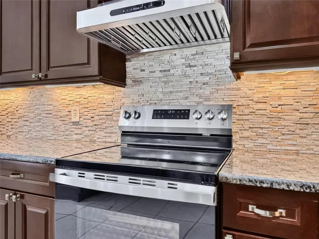 an aerial view of a house with outdoor space and lake view