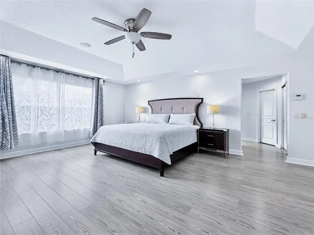 a view of a swimming pool with a patio