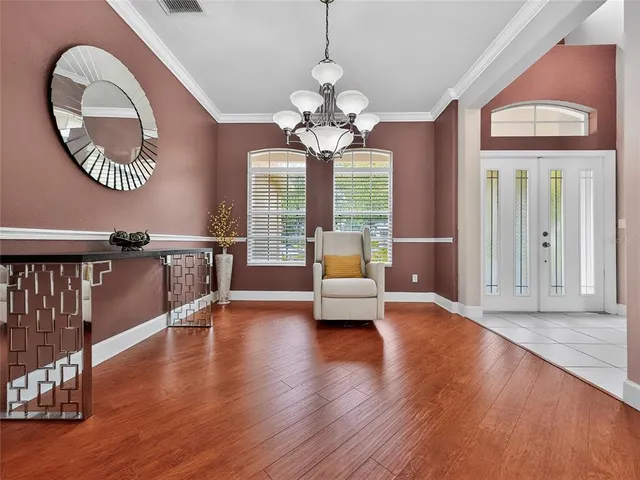 a kitchen with stainless steel appliances granite countertop a refrigerator stove and cabinets