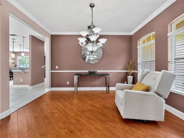 a bedroom with a bed and a lamp on table