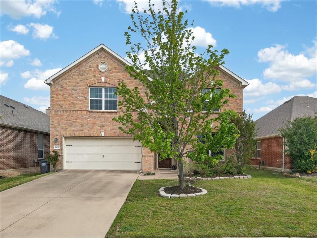 2679 Lake Ridge Drive Little Elm, TX 75068 - Photo 1 of 40 a front view of house with a garden