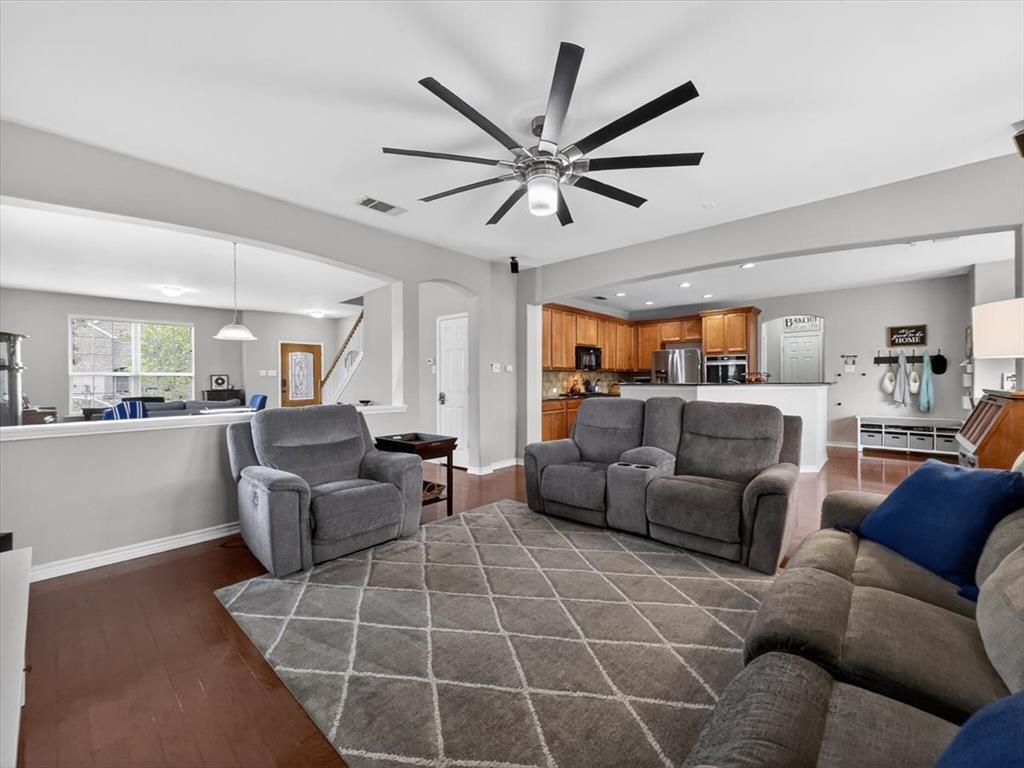 2679 Lake Ridge Drive Little Elm, TX 75068 - Photo 11 of 40 a living room with furniture a ceiling fan and a window