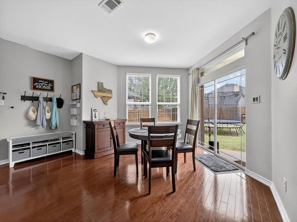 2679 Lake Ridge Drive Little Elm, TX 75068 - Photo 13 of 40 a dining room with furniture and wooden floor