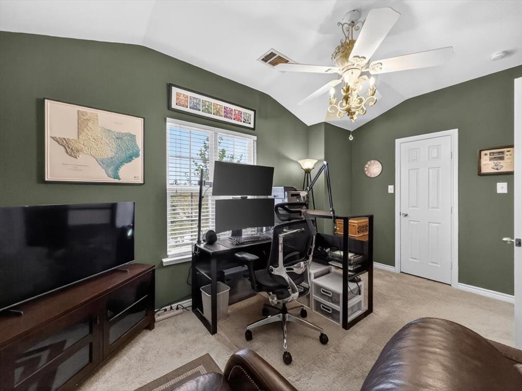 2679 Lake Ridge Drive Little Elm, TX 75068 - Photo 27 of 40 a view of a livingroom with furniture and a flat screen tv