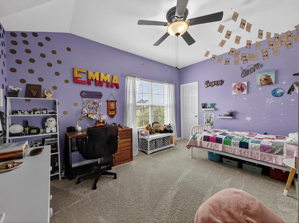 2679 Lake Ridge Drive Little Elm, TX 75068 - Photo 29 of 40 Bedroom with wallpapered walls, an accent wall, light colored carpet, ceiling fan, and vaulted ceiling