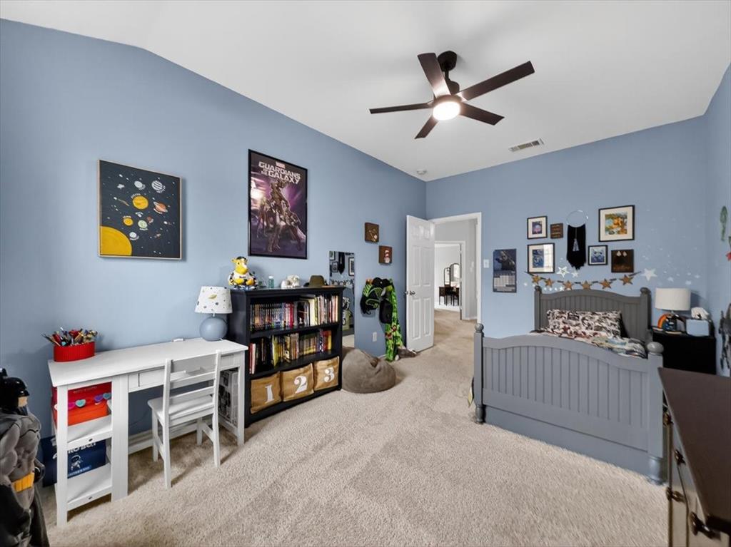 2679 Lake Ridge Drive Little Elm, TX 75068 - Photo 32 of 40 Carpeted bedroom with ceiling fan and vaulted ceiling