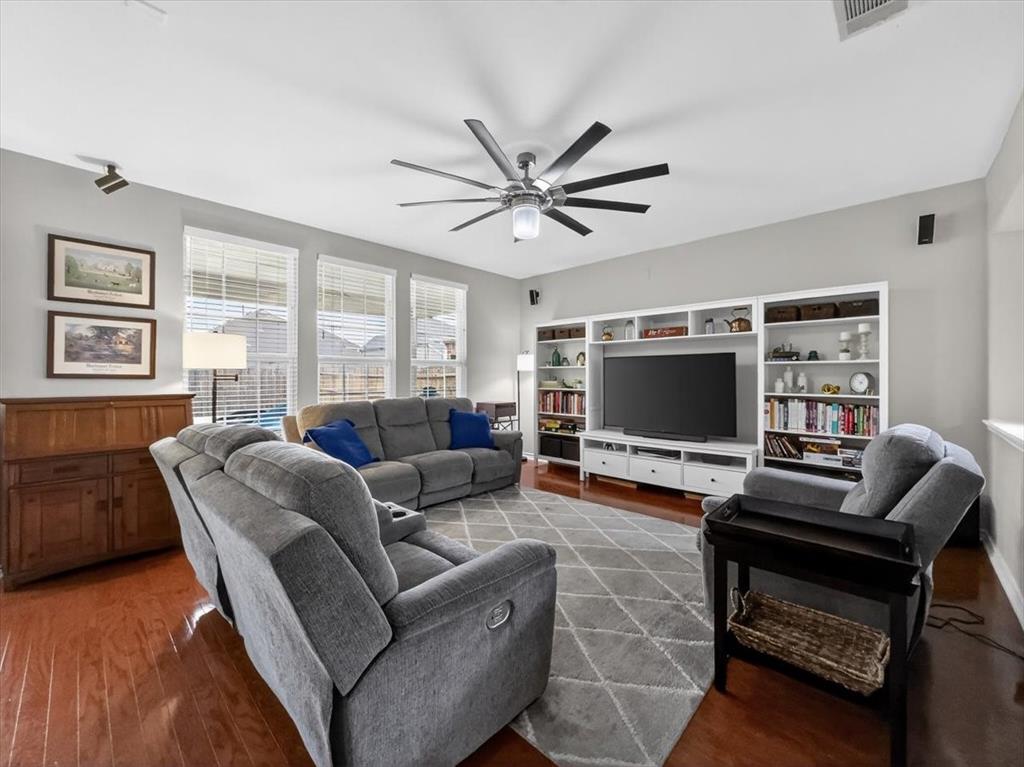 2679 Lake Ridge Drive Little Elm, TX 75068 - Photo 10 of 40 a living room with furniture and a flat screen tv