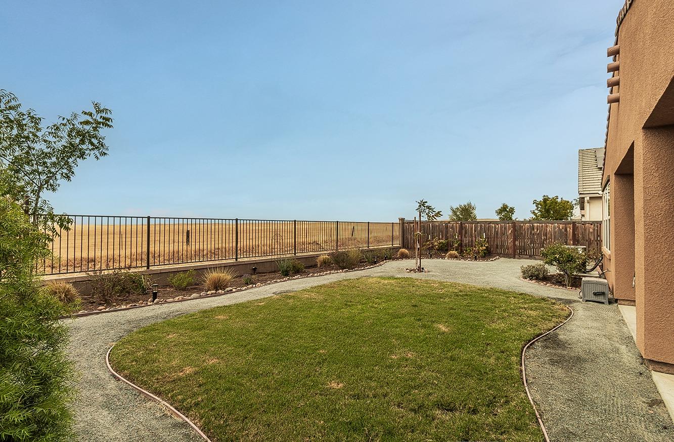 4628 Hillside Road Madera, CA 93636 - Photo 28 of 69 The backyard is overlooking the walking trail and pasture.