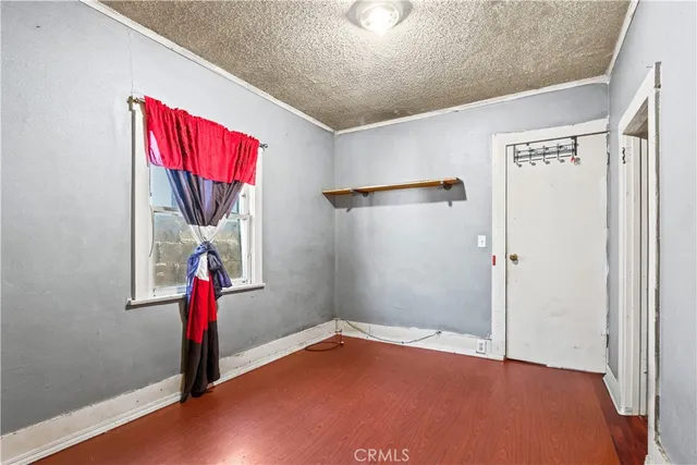 a view of a room with furniture and a window