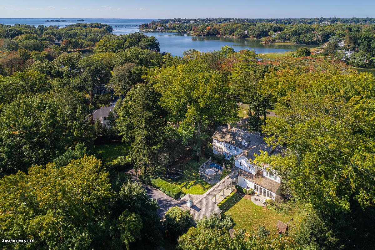 an aerial view of a houses with a lake view