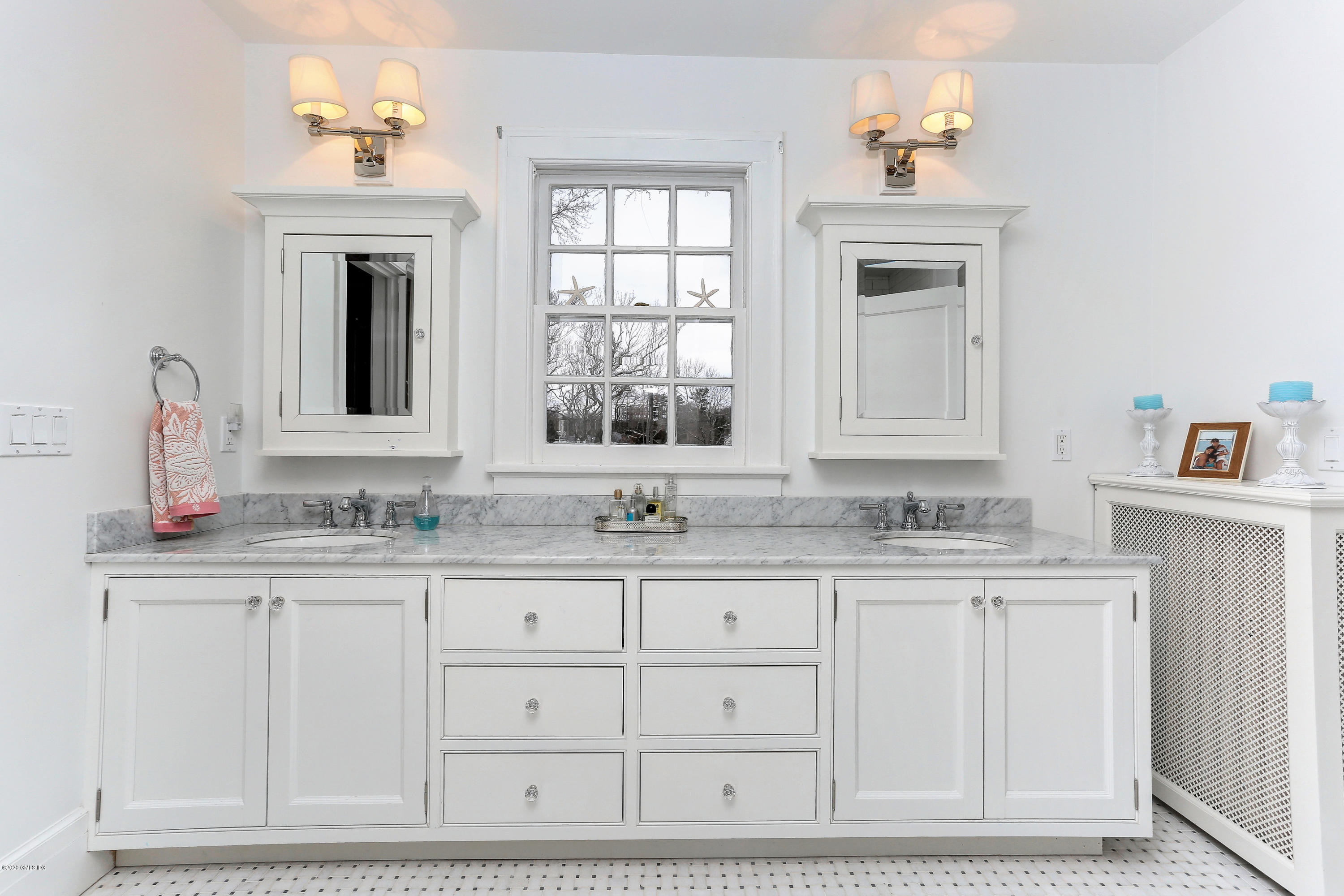10 Indian Chase Drive Greenwich, CT 06830 - Photo 11 of 27 a bathroom with a sink and a window