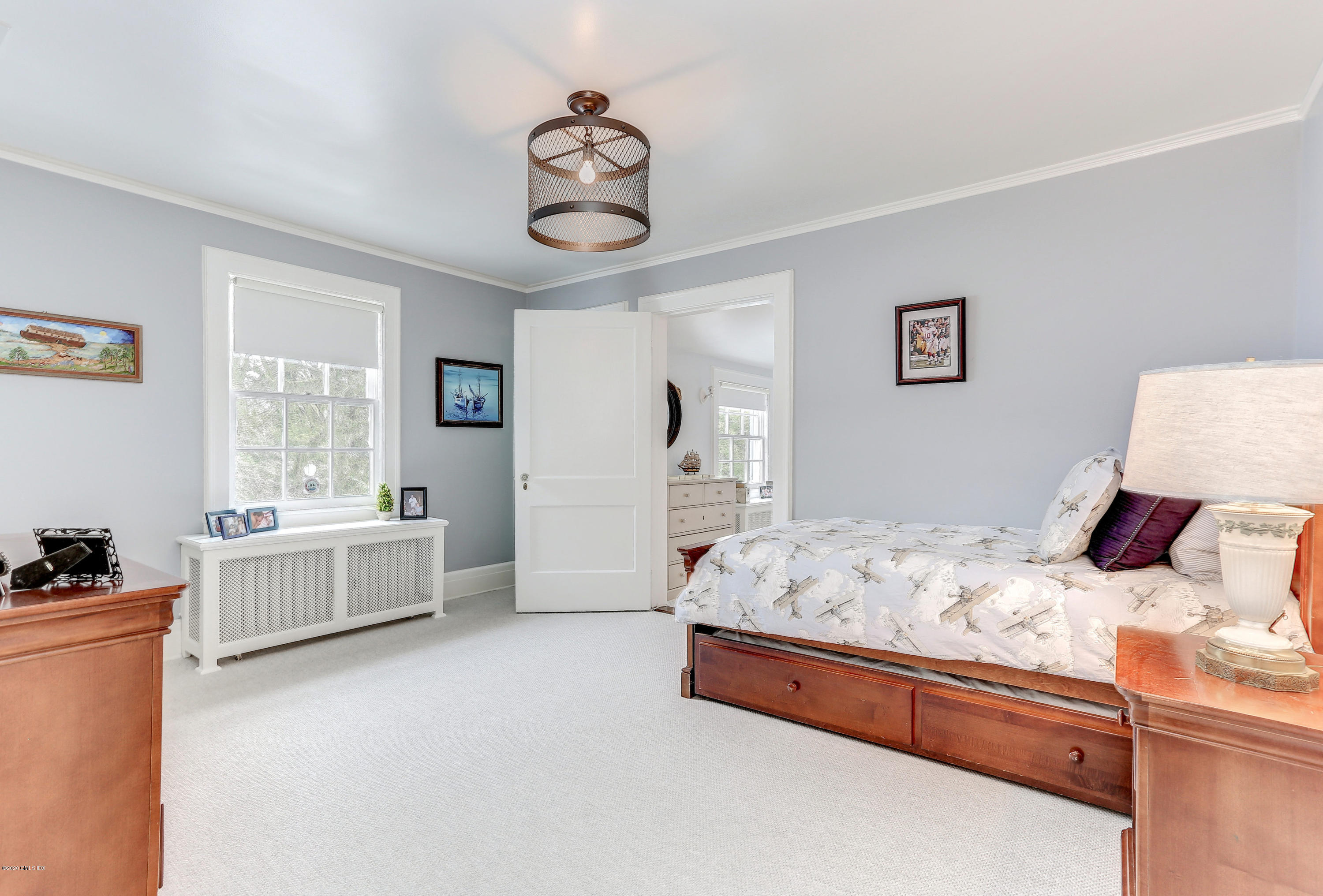 10 Indian Chase Drive Greenwich, CT 06830 - Photo 13 of 27 a bed room with a bed and a window