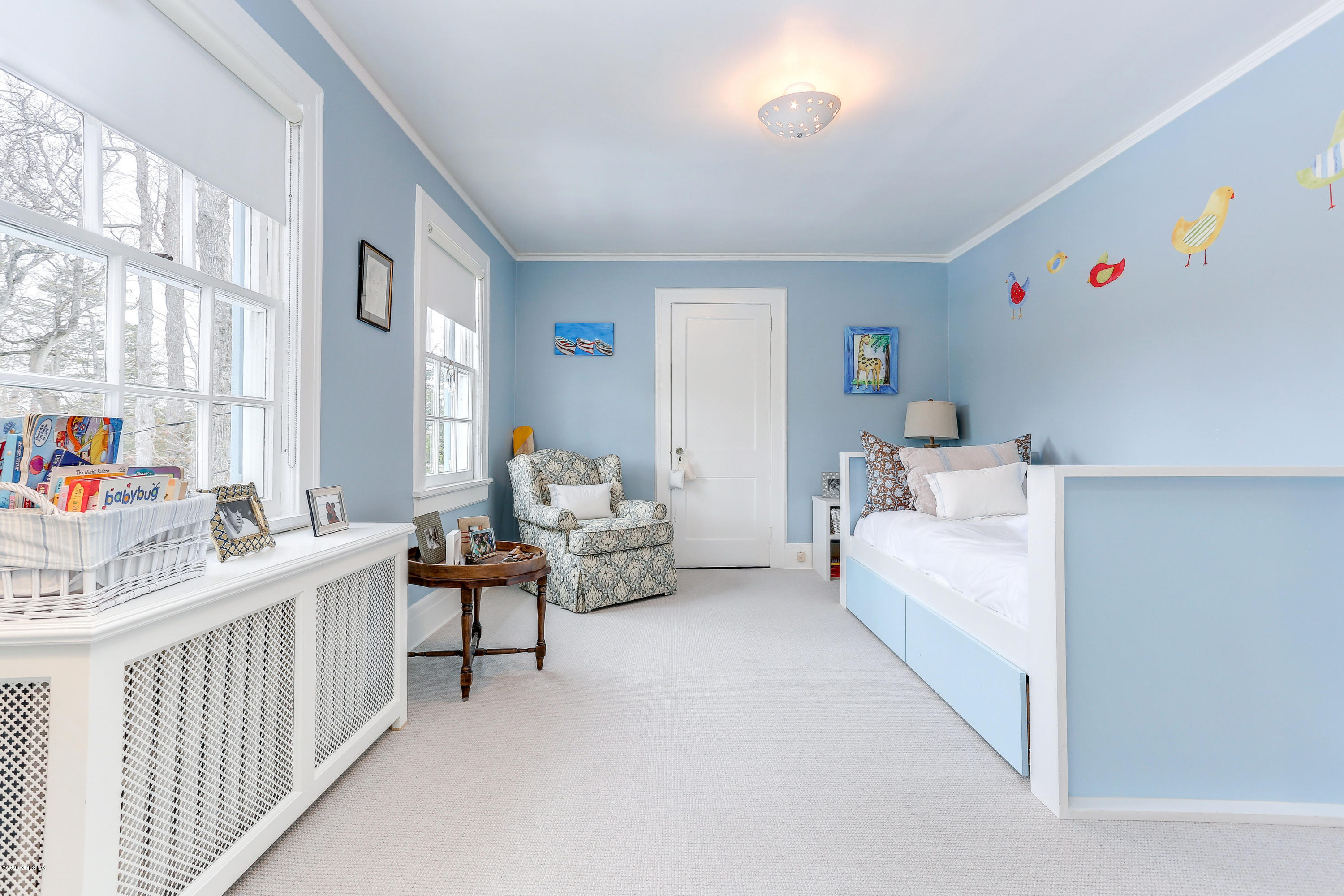 10 Indian Chase Drive Greenwich, CT 06830 - Photo 14 of 27 a bedroom with furniture and a large window