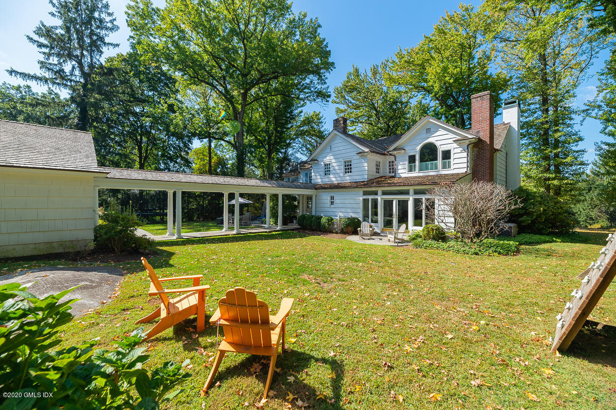 10 Indian Chase Drive Greenwich, CT 06830 - Photo 18 of 27 a front view of house with yard and green space