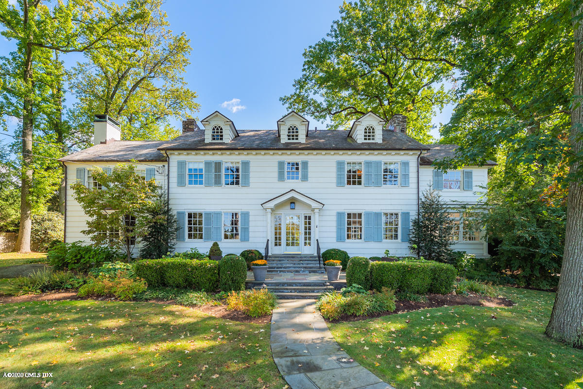 10 Indian Chase Drive Greenwich, CT 06830 - Photo 2 of 27 a front view of a house with a yard