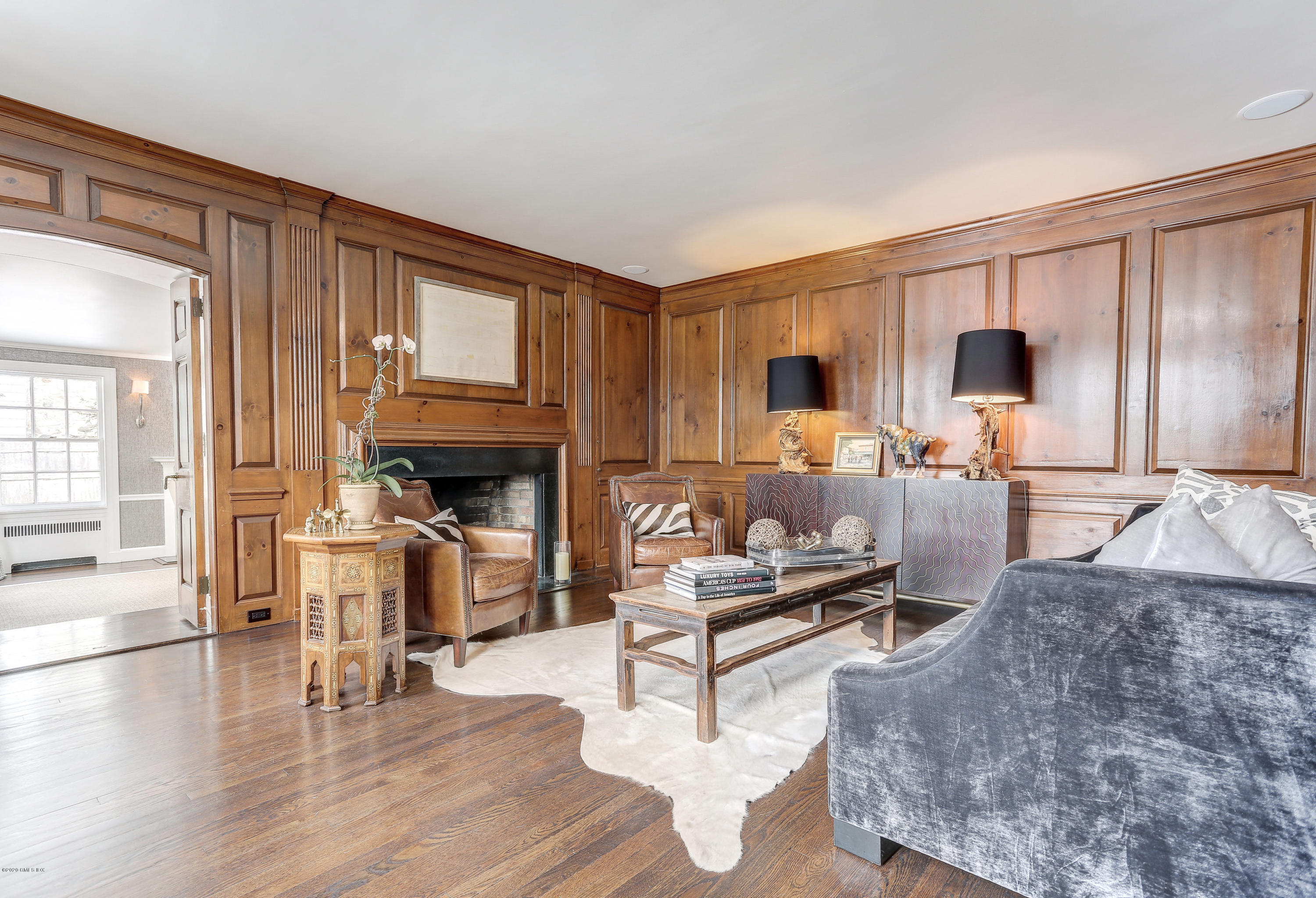 10 Indian Chase Drive Greenwich, CT 06830 - Photo 5 of 27 a living room with furniture wooden floor and a fireplace