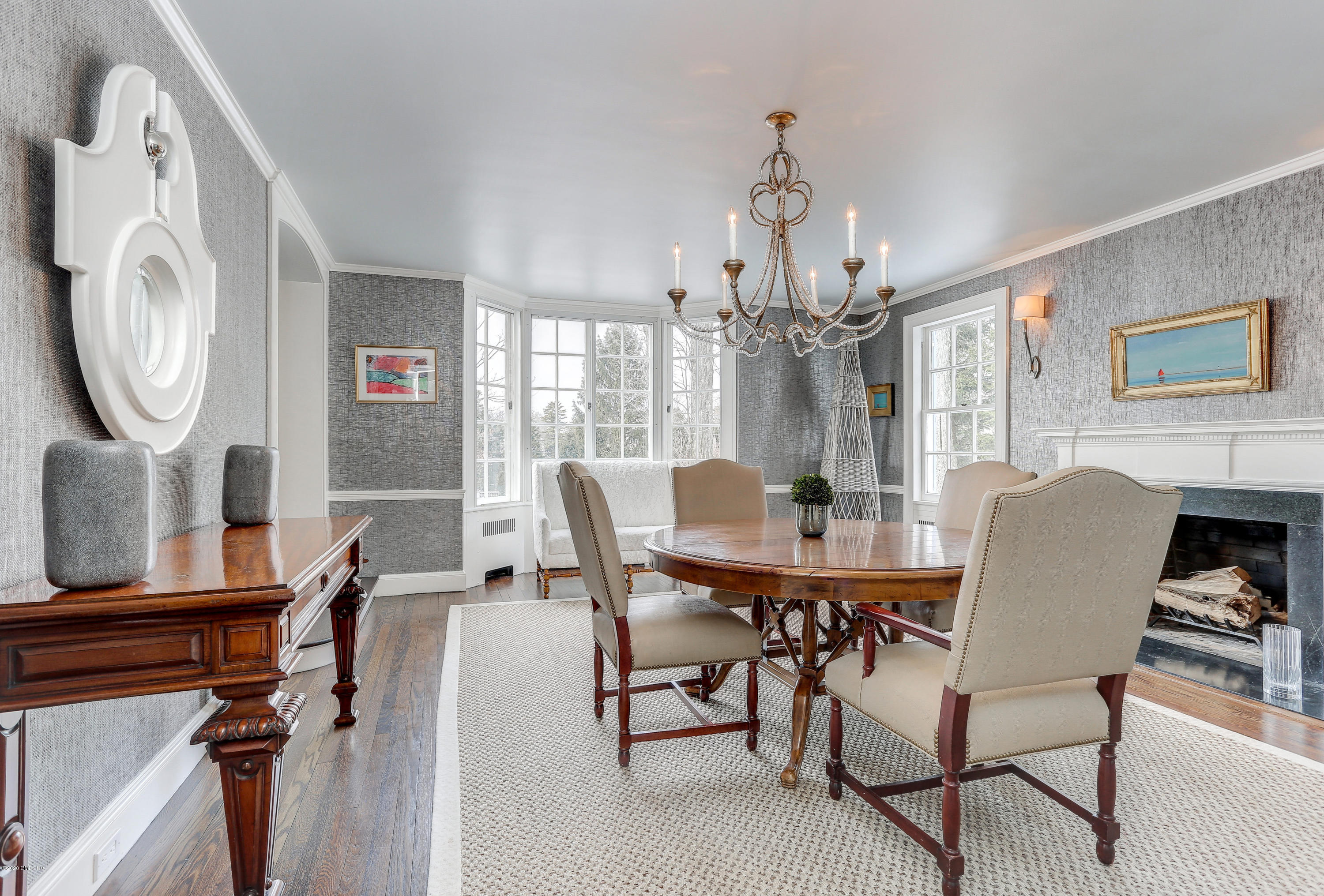 10 Indian Chase Drive Greenwich, CT 06830 - Photo 6 of 27 a view of a dining room with furniture and chandelier