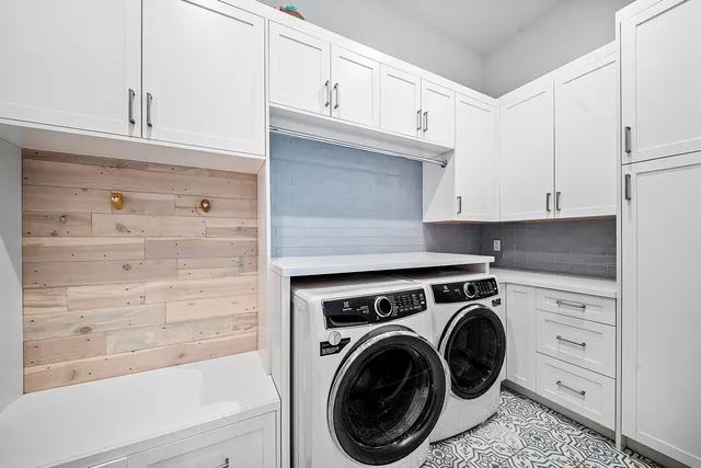 a view of a kitchen with cabinets and a stove top oven