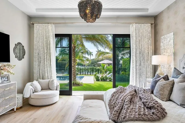 a living room with couch and a large window