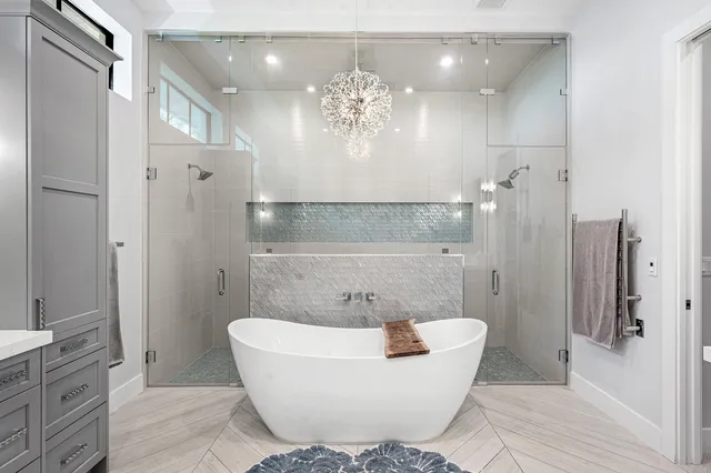 a bathroom with a bathtub and shower