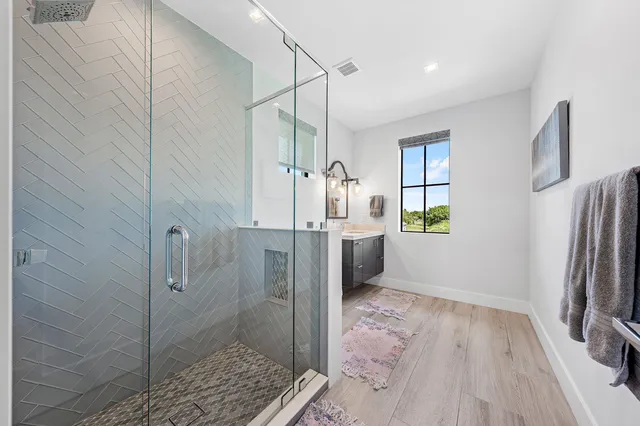 a bathroom with a sink and shower