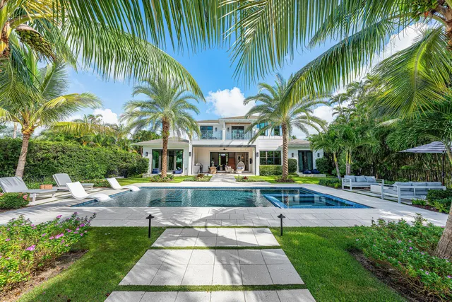 a view of a swimming pool with a table and chairs