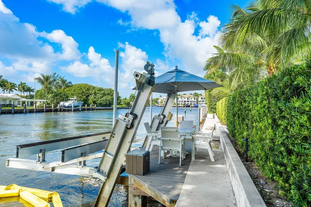 a view of a lake with a house swimming pool and outdoor space