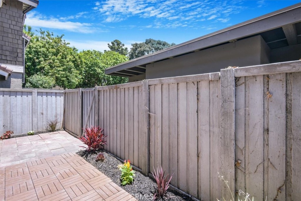 229 Springview Irvine, CA 92620 - Photo 18 of 30 a view of a backyard with wooden fence