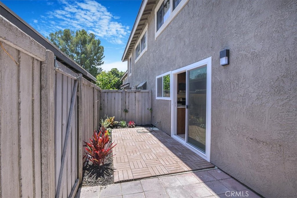 229 Springview Irvine, CA 92620 - Photo 19 of 30 a backyard of a house with table and chairs