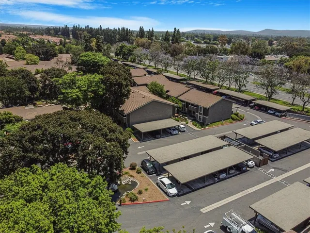 an aerial view of a house with a yard and plants