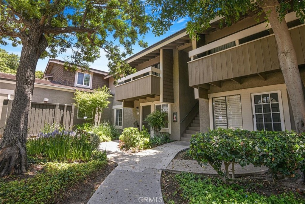 229 Springview Irvine, CA 92620 - Photo 27 of 30 a front view of a house with a yard