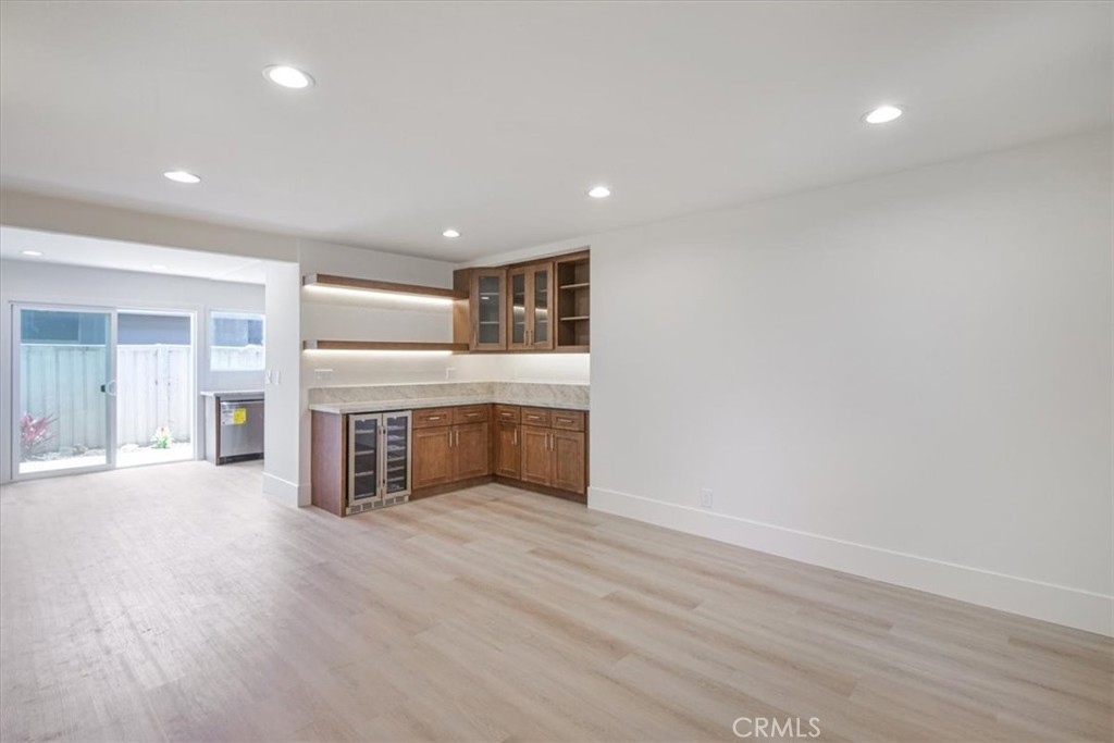 229 Springview Irvine, CA 92620 - Photo 8 of 30 an empty room with wooden floor and windows