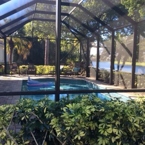 a view of a street with a bench in the patio
