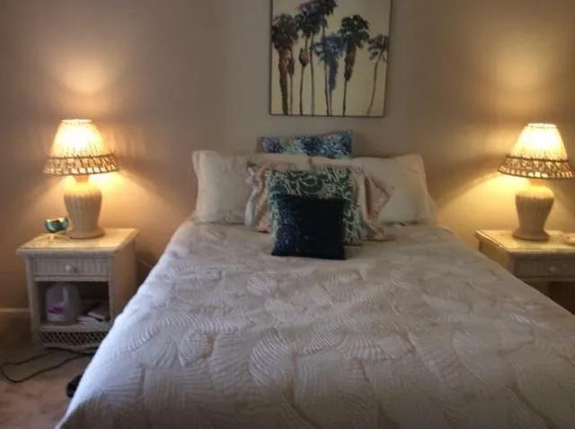 a bed room with a bed and a lamp