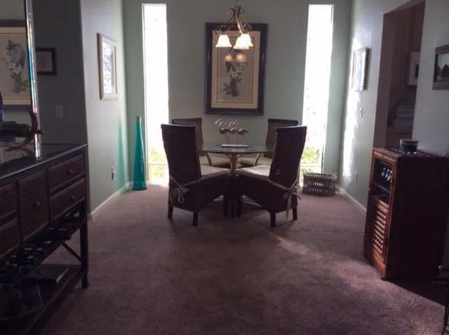 a view of a livingroom with furniture and a flat screen tv