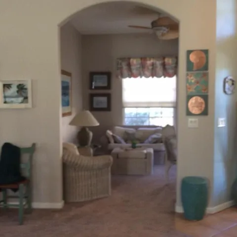 a living room with furniture and a window
