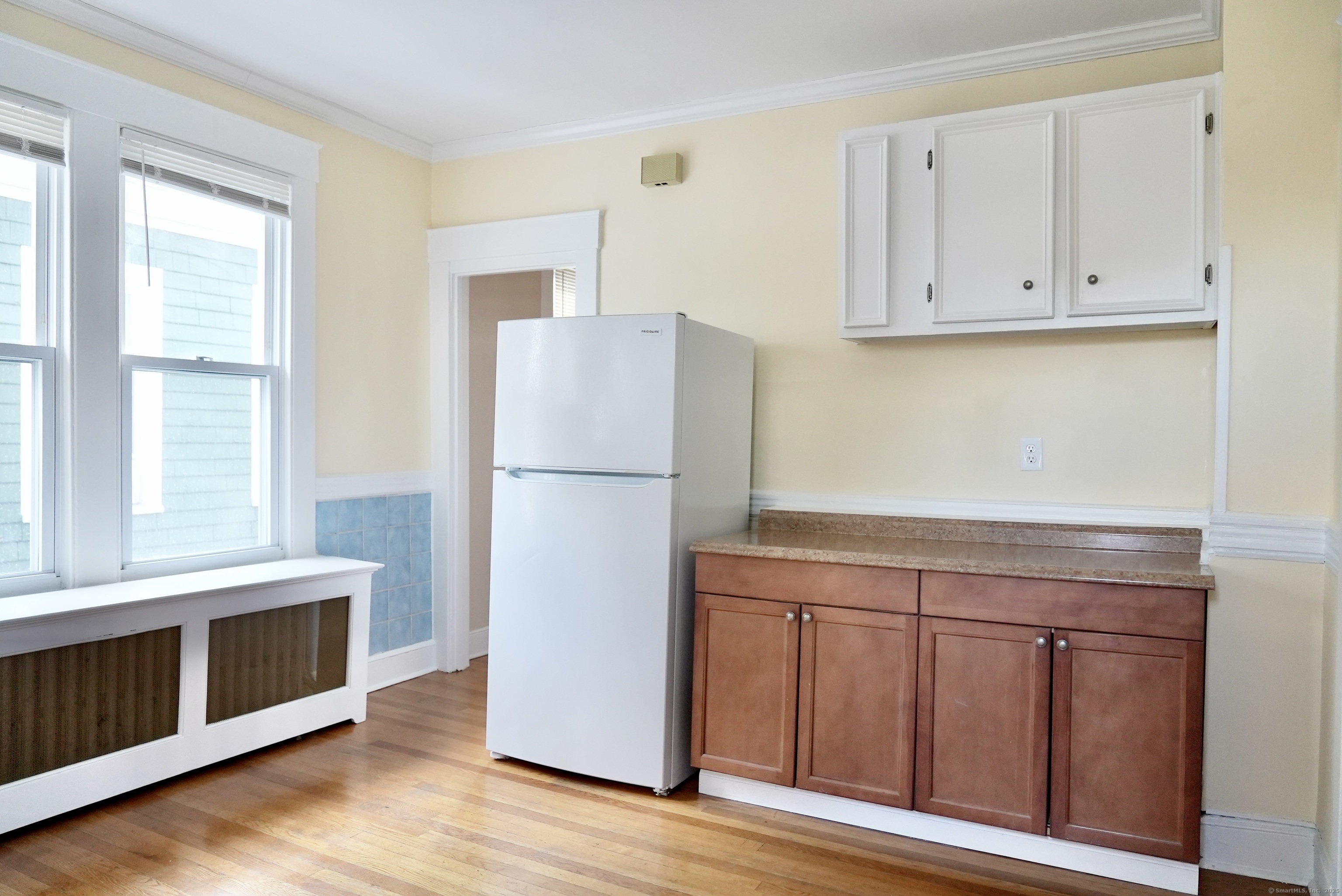39 Pardee Place New Haven, CT 06515 - Photo 12 of 32 a kitchen with cabinets a refrigerator and a stove