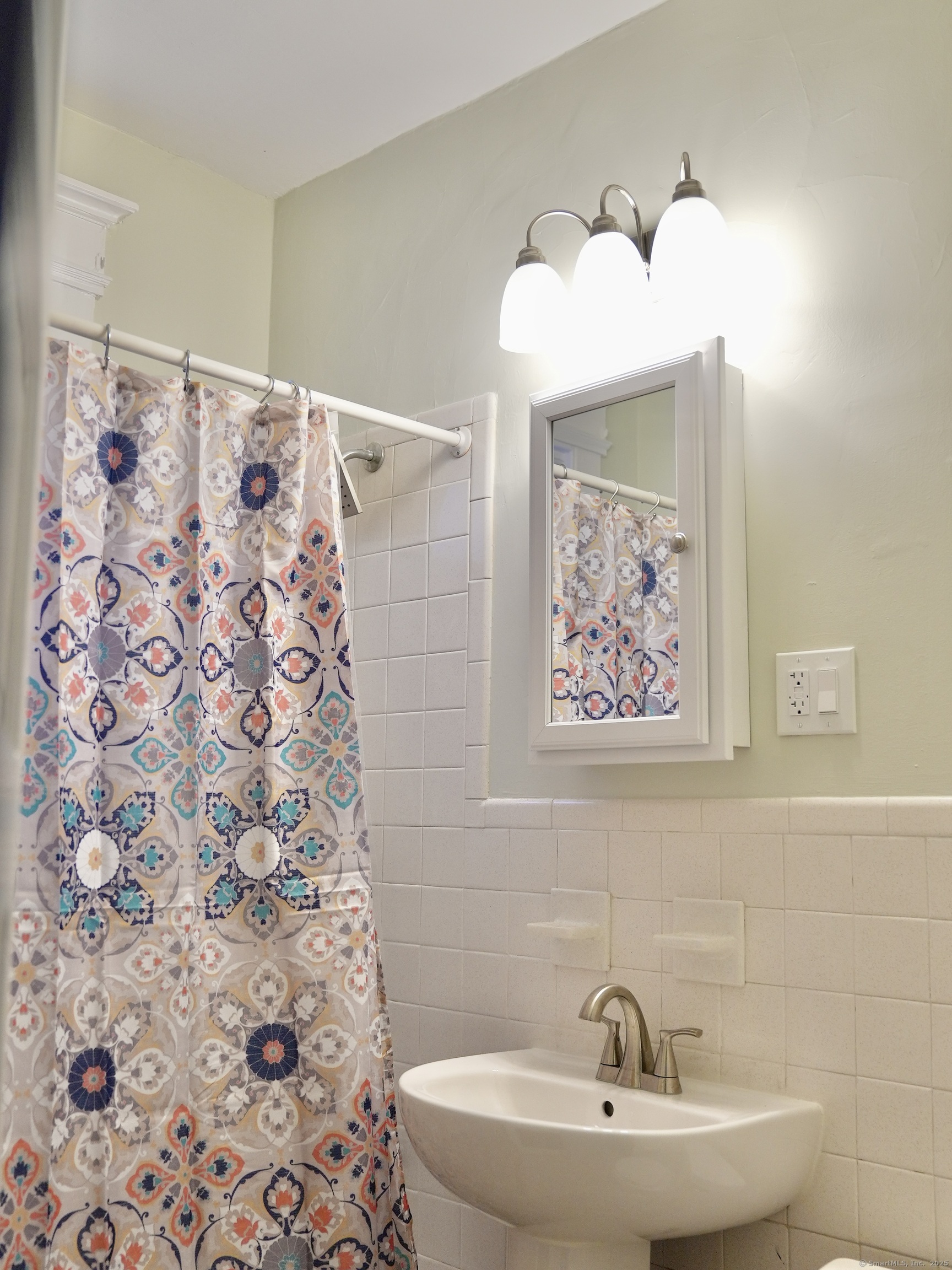 39 Pardee Place New Haven, CT 06515 - Photo 18 of 32 a bathroom with a sink and mirror with toilet