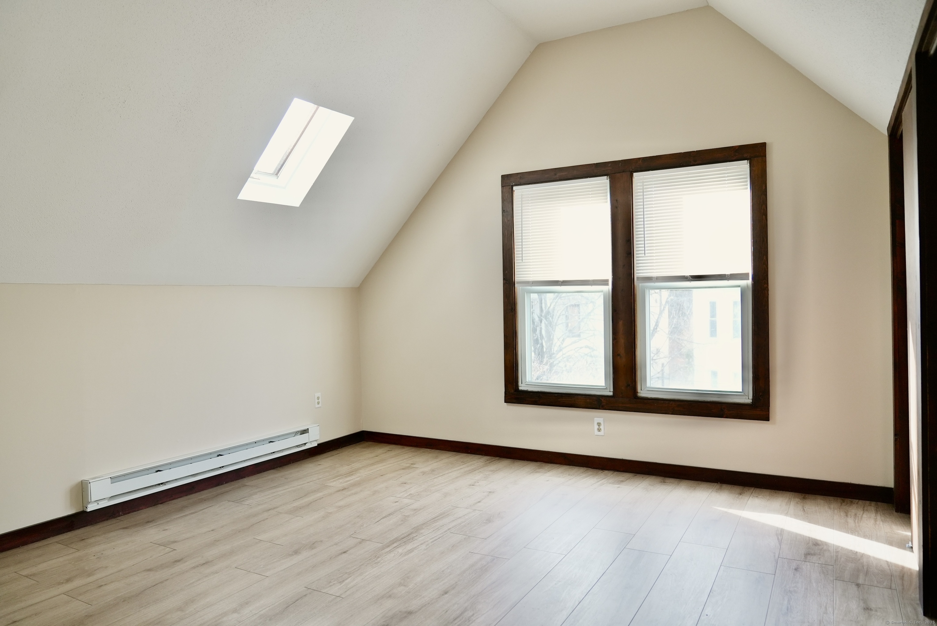 39 Pardee Place New Haven, CT 06515 - Photo 25 of 32 an empty room with wooden floor and windows