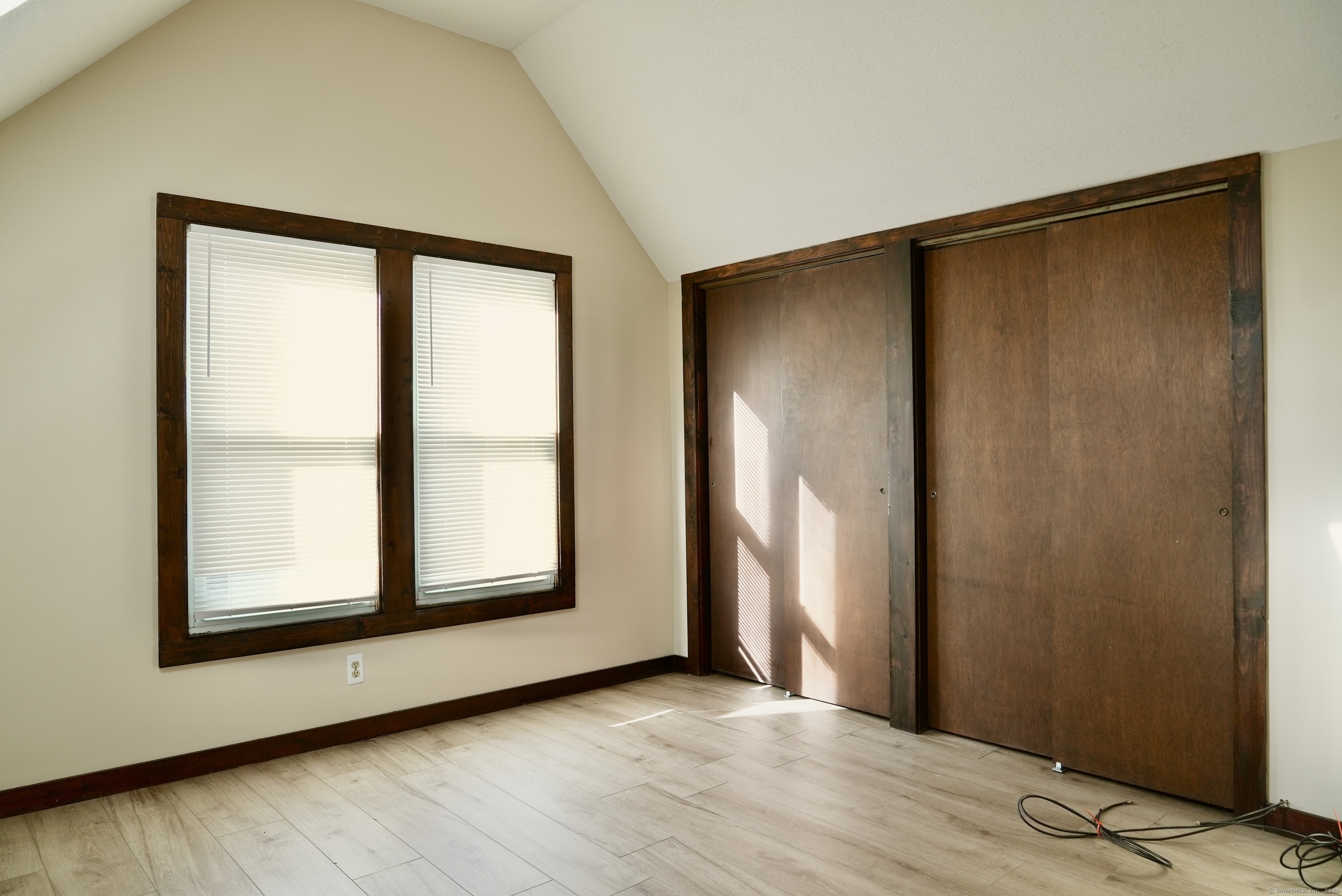 39 Pardee Place New Haven, CT 06515 - Photo 26 of 32 an empty room with wooden floor and windows