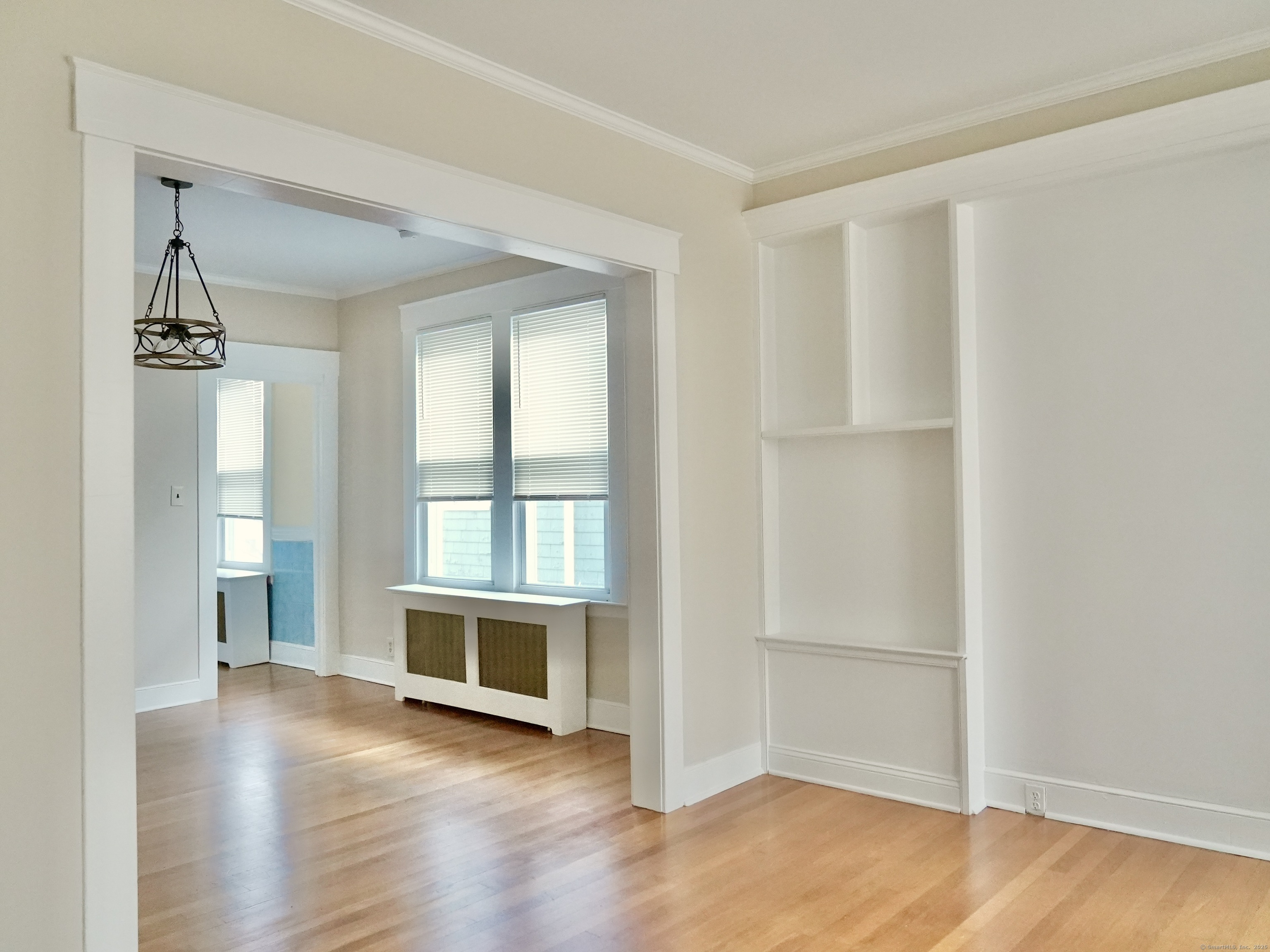 39 Pardee Place New Haven, CT 06515 - Photo 5 of 32 an empty room with wooden floor and windows